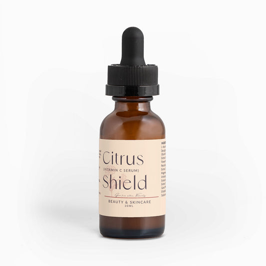 Citrus Shield Serum bottle with dropper for brightening and hydrating skin, rich in Vitamin C and antioxidants, 30ml